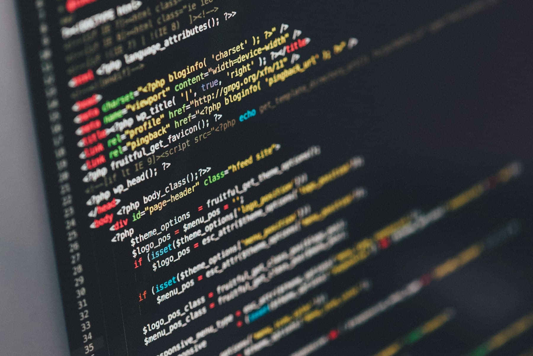 Code editor and laptop representing modern web development services
